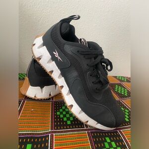 Black women’s Reebok sneakers.